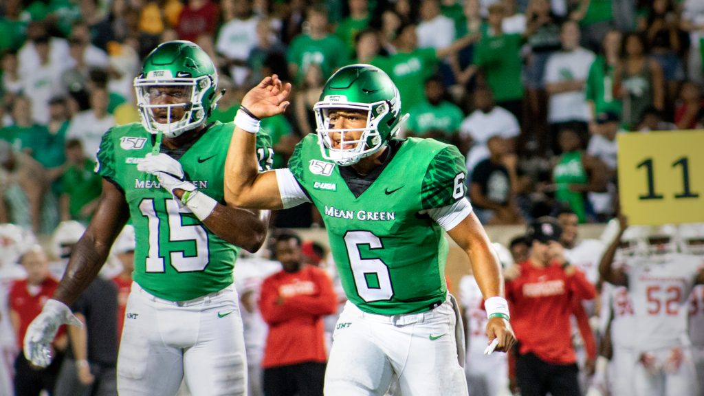 Senior quarterback Mason Fine yells to his teammates before a play during the Mean Green’s game against Houston at Apogee Stadium on Sept. 28, 2019. Image by Jordan Collard