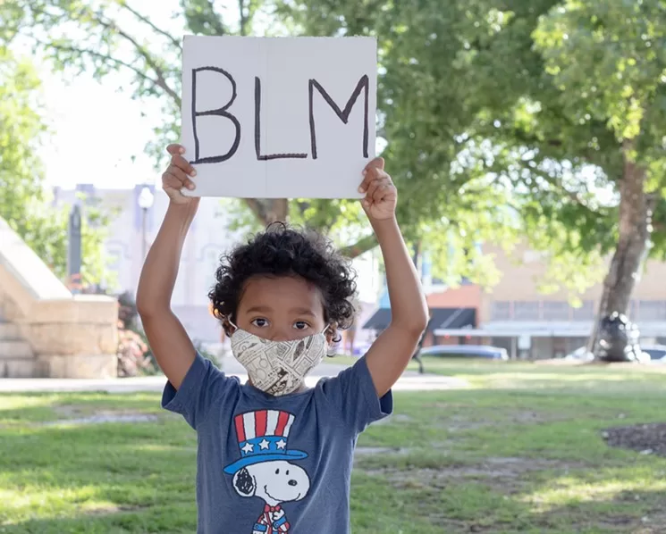 Activist Leo Isma, 4, holds a Black Lives Matter sign ahead of Tuesday's vote to remove Denton's Confederate monument. It was his first protest.