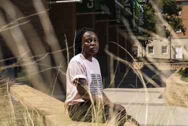 Aimee Tambwe, a sophmore, outside of the student union on the campus of the University of North Texas in Denton. Ambwe noticed extra fees to her tuition after classes went virtual as a result of the coronavirus pandemic.