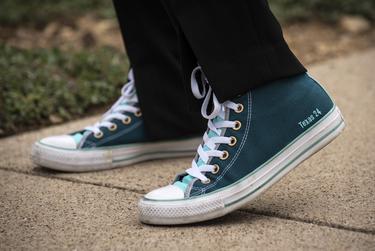 Candace Valenzuela, candidate for Texas' 24th Congressional District, sports her custom Converse shoes with "Texas 24" lettering on the side of the shoes, outside her home in Dallas on July 29, 2020.