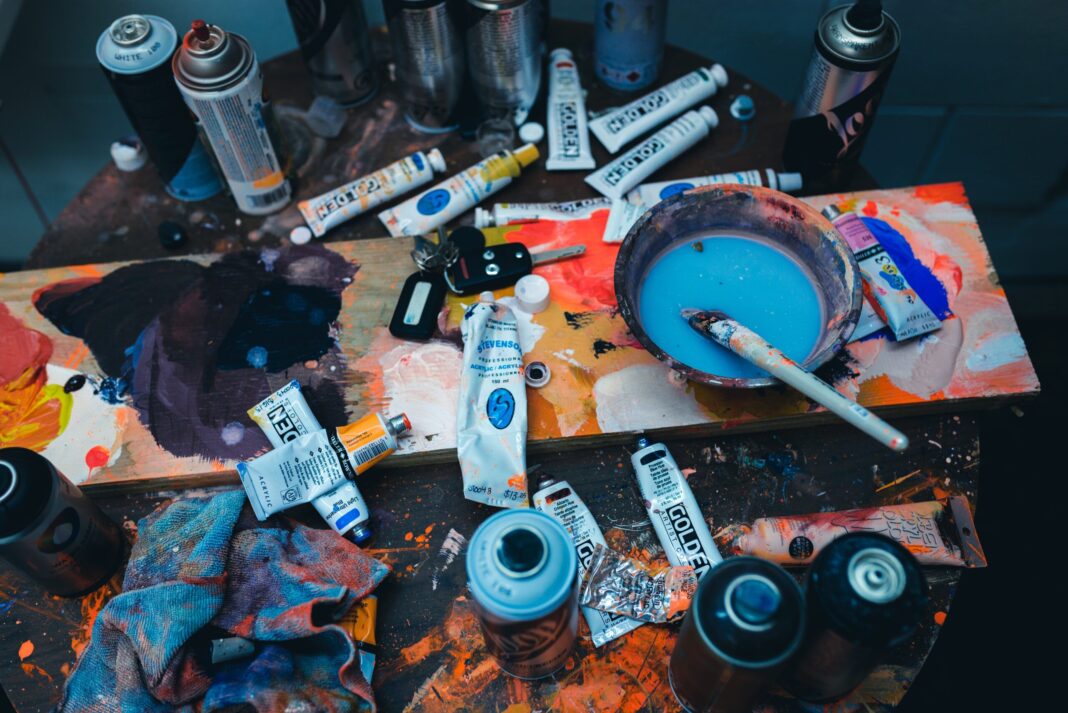 brown paint brush on gray plastic bowl